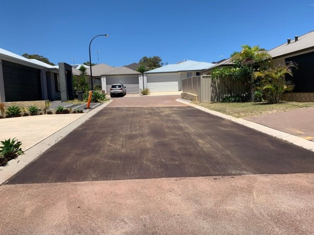 Sinagra asphalt repair in housing estate with one car